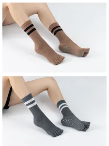 Non-slip yoga pilates socks with toe design and striped cuffs, comfortable detail view.