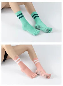 Detailed view of striped five toe non slip yoga socks, perfect for pilates and dance practice.