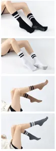 Detail view of anti-slip yoga pilates socks featuring stylish double stripes and toes.