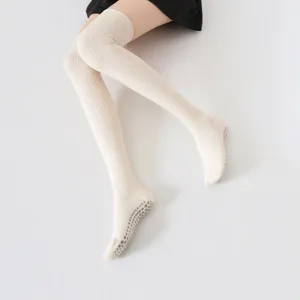 Over-the-knee non-slip yoga socks with ribbed design, comfortable and leg-shaping style.