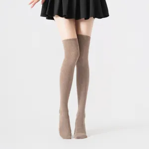 Women over-the-knee ribbed compression socks, stylish autumn winter long leg warmers.