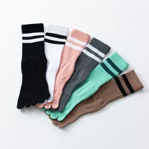 Detailed view of colorful five-finger toe socks with stripe cuff design for yoga and pilates.