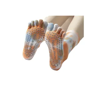Tie-dye yoga five-toe socks with non-slip silicone grips, mid-calf length, comfortable.