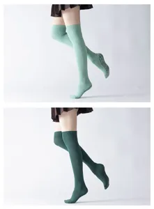 Over-the-knee yoga socks with non-slip grips, thick ribbed knit leg warmers for pilates and fitness.