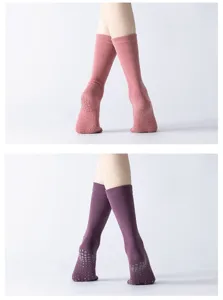 Anti-slip yoga socks detail showing breathable knit fabric and grip dots for pilates and dance.