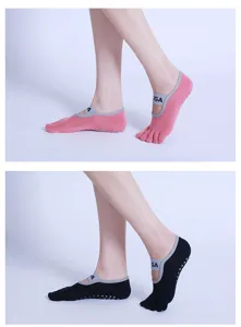 Detailed view of five-finger yoga grip socks with cross straps and non-slip silicone dots.