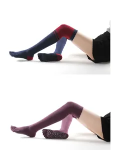 Over-the-knee five-toe yoga socks with anti-slip grip sole, ideal for dance, fitness and warmth.