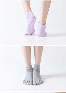 Women's anti-slip yoga socks with grip dots and five-toe design for pilates and fitness workouts.