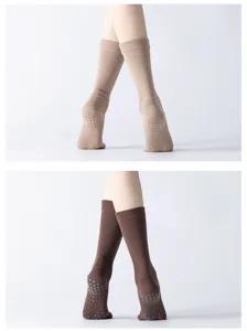 Non-slip grip yoga pilates socks detail view, ribbed high tube design in beige and brown.