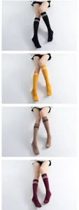Knee high tube socks with double stripes preppy style soft knit casual hosiery pair.