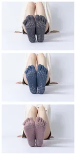 Detailed view of five-toe yoga socks with anti-slip grip dots on the sole for training.