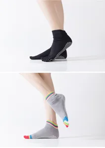 Women professional yoga five toe grip socks with anti slip dots for fitness training.