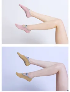 Five-toe yoga socks with anti-slip grip dots and elastic cross strap for pilates dance fitness.