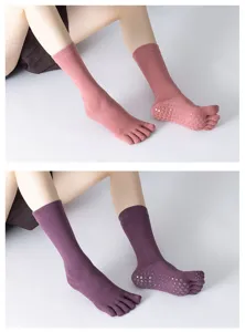 Solid color five-toe yoga socks with non-slip grips, high tube athletic pilates socks for women.
