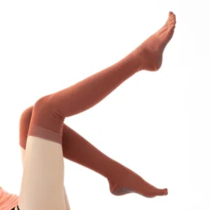 Over-the-knee yoga socks with non-slip grips and five-toe design for pilates and dance workout.