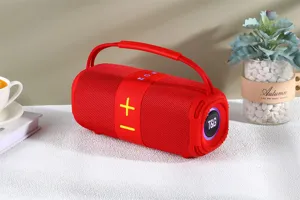 Enceinte Bluetooth sans fil portable rouge avec tissu, lumières LED et poignée de transport.