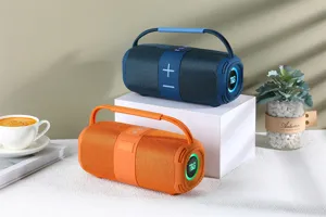 Vue détaillée de haut-parleurs Bluetooth sans fil portables avec tissu et lumières LED.