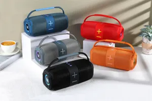 Haut-parleur Bluetooth sans fil portable avec poignée, lumières LED et basses puissantes.