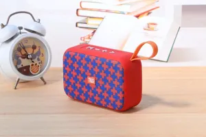 Portable wireless Bluetooth speaker with vibrant houndstooth mesh pattern and handy strap.