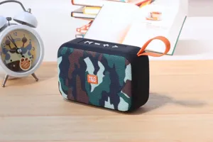 Portable wireless Bluetooth speaker with camo mesh fabric and convenient orange strap.