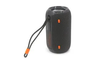 Detailed view of portable wireless bluetooth speaker with mesh fabric and strap.