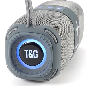 Haut-parleur Bluetooth sans fil portable avec design en tissu et LED, vue détaillée.