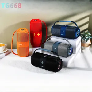 Enceinte Bluetooth sans fil portable avec tissu, lumières LED et poignée pour l'extérieur.