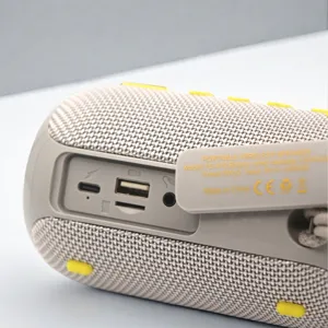 Portable wireless bluetooth speaker with waterproof fabric design and dual bass sound.
