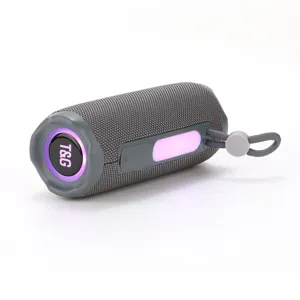 Portable wireless bluetooth speaker detail view, grey fabric mesh and colorful ambient lighting.