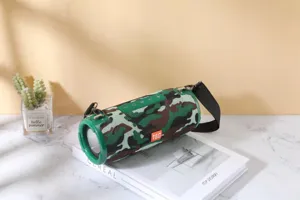 Portable wireless Bluetooth speaker with camo fabric design, powerful bass and strap.