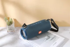 Portable wireless bluetooth speaker with deep bass, waterproof fabric design and strap for outdoor.