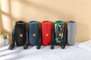 Portable waterproof bluetooth fabric cylinder speaker with dual diaphragm and strap.