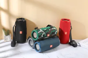 Portable wireless Bluetooth speaker with waterproof fabric mesh and deep dual passive radiators.