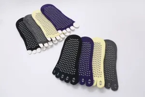 Non-slip five toe yoga socks with grip for pilates, fitness and workout practice.