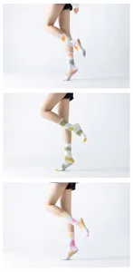 Detailed view of tie-dye yoga socks with non-slip grip dots on the sole for pilates balance.