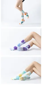 Detailed close-up view of colorful tie-dye non-slip yoga pilates socks showcasing bottom grip dots.