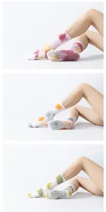 Detailed view of tie-dye non-slip yoga socks with anti-skid grip dots on sole for pilates.