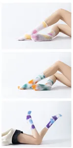 Detailed view of tie-dye grip yoga socks with non-slip dotted soles for pilates and fitness.