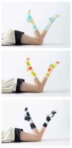Detail view of tie-dye non-slip yoga pilates calf socks with grip dots for stable workout.