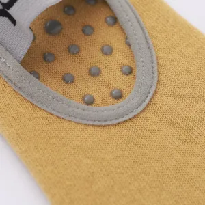 Non-slip yoga and pilates socks with grip dots, breathable knit fabric for fitness workouts.