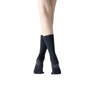 Black non-slip yoga socks with grip dots for pilates, dance, and fitness workouts.