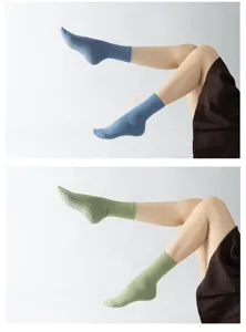 Non-slip pilates grip yoga socks for women, breathable ribbed mid-tube sports socks for fitness.