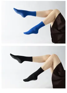 Detail view of non-slip yoga socks with grip dots, comfortable athletic wear for pilates workout.