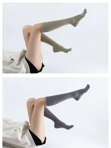 Detail view of ribbed yoga grip toe socks with anti-slip dots, comfortable athletic wear.