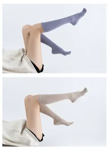 Detailed view of women's toe separation yoga socks with anti-slip grip dots and breathable knit.