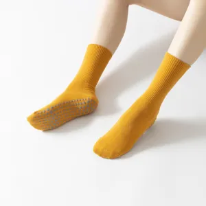 Non-slip yellow yoga socks for women, breathable cotton pilates socks with grip soles.