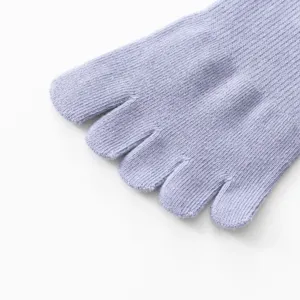 Close-up of light purple five toe socks showing fine knit texture and split toe.