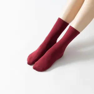 Red ribbed crew socks for women, classic solid color casual cotton calf socks for daily wear.