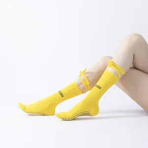 Yellow yoga socks with straps, non-slip pilates and fitness socks for women, breathable.