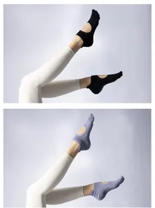 Detail view of professional women's yoga pilates five-toe grip socks with non-slip dots.